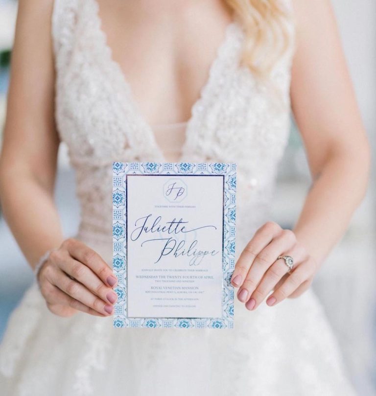 bride holding invitation 768x809