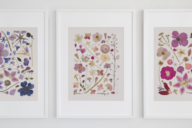 minimal mockup featuring three art prints hanging on a white wall 554 el 2 768x512