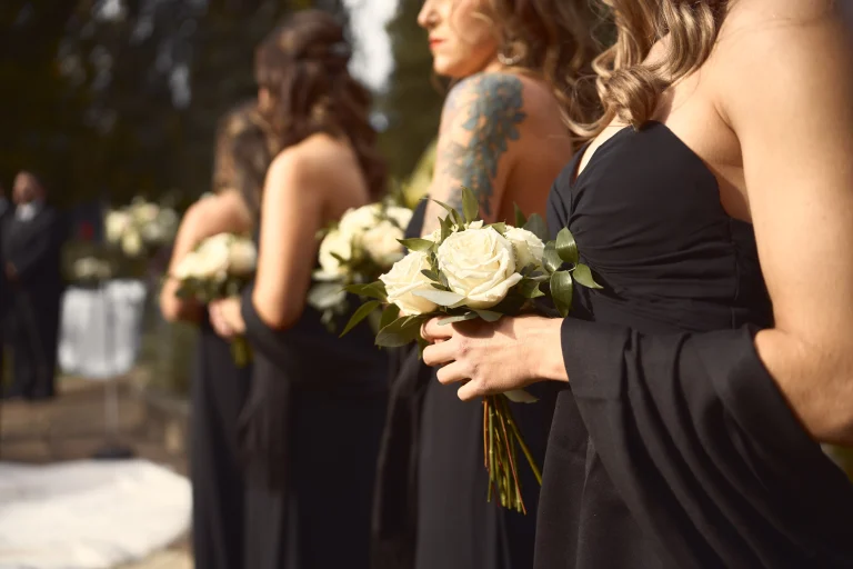 Wedding moment with bouquets being held outdoors 768x512