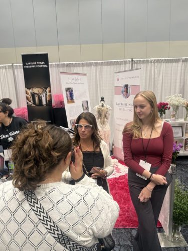 Canada's Bridal Show October 2026 - Visitors at a photography and bridal exhibitor booth