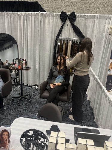 Canada's Bridal Show October 2026 - Bridal beauty booth with a black bow backdrop