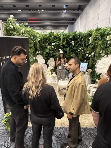 Canada's Bridal Show October 2026 - Exhibitor booth with a lush greenery and white floral wall