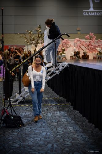 Canada's Bridal Show October 2026 - Smiling guest coming down the stage steps