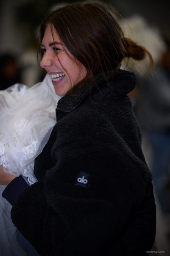 Canada's Bridal Show October 2026 - Laughing guest carrying an armful of white tulle