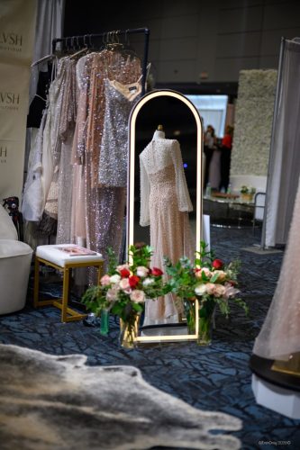 Canada's Bridal Show October 2026 - Boutique booth with gown racks, a gold mirror and florals